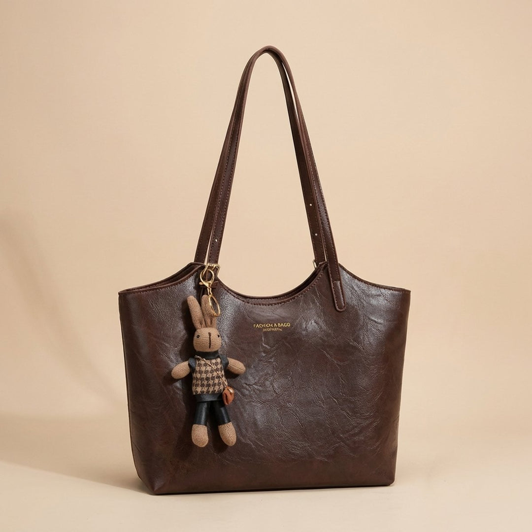 Damen Veganleder Tote Bag mit Plüsch-Anhänger Schultertasche
